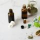 Herbal medicine bottles, capsules, and dried herbs on table
