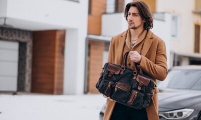 A Man Wearing a Jacket and Carrying a Bag