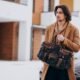 A Man Wearing a Jacket and Carrying a Bag