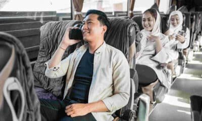 Happy man sitting enjoying his trip using a bus